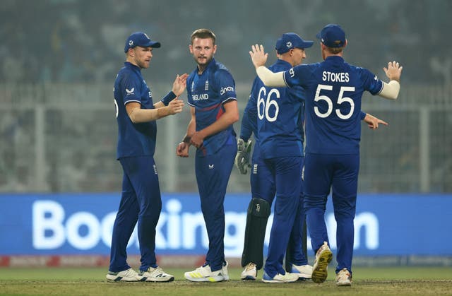 <p>Ben Stokes goes to congratulate England’s Gus Atkinson (centre) after he took the wicket of Pakistan’s Babar Azam </p>