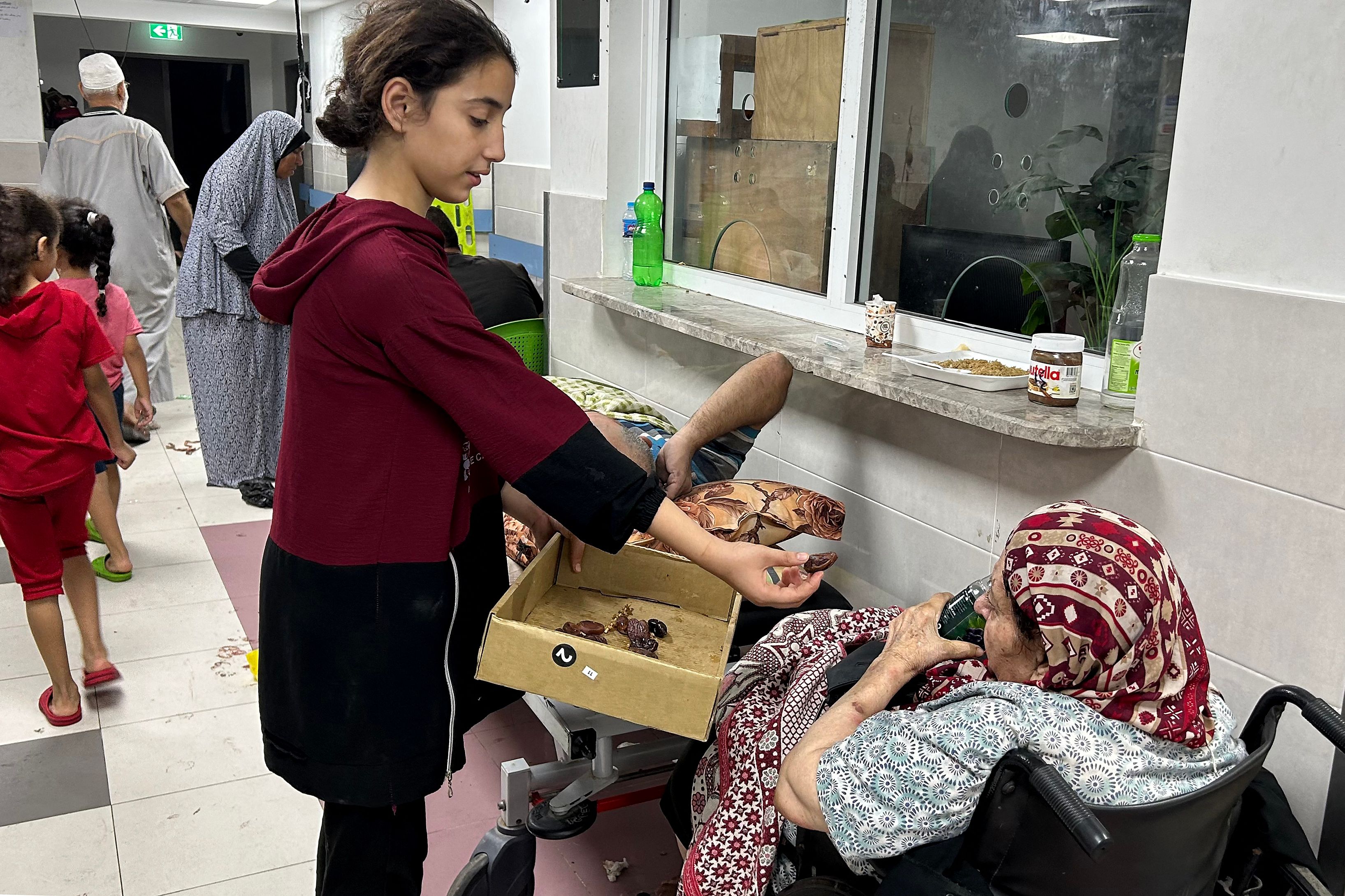 Patients and internally displaced people are pictured at Al-Shifa hospital in Gaza City on November 10, 2023