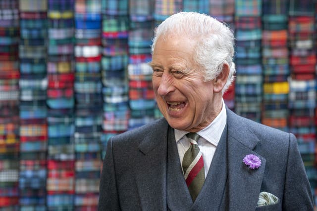 The King during a visit to Lochcarron of Scotland at the Waverley textile mill in Selkirk in July (Jane Barlow/PA)