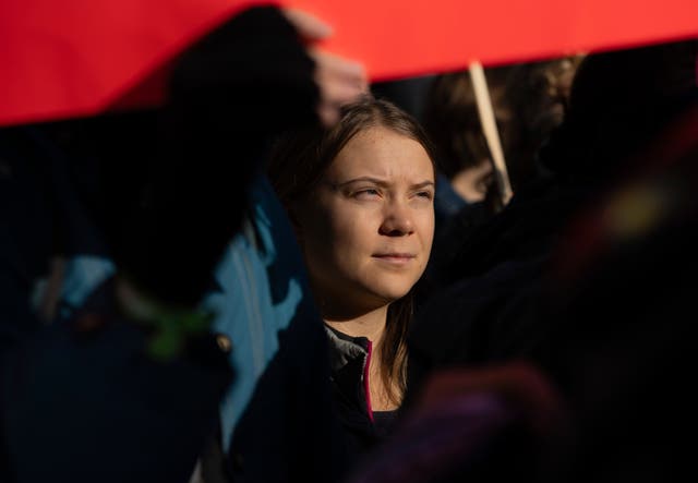 <p>Activist Greta Thunberg was among those walking through the historic heart of the Dutch capital</p>