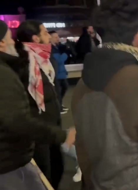 Officers are investigating this man who styled his long dark hair held up in a pony tail and wore a red and white scarf in relation to a hate crime