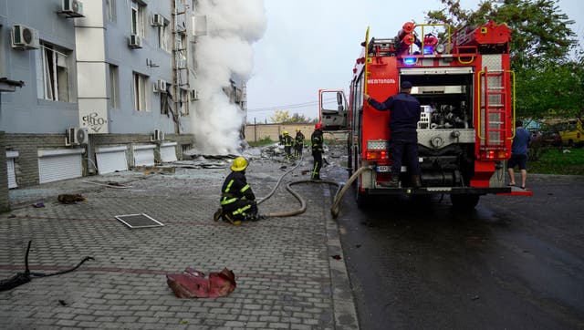 <p>File photo: Firefighters work at the site of a car bomb explosion in the Russian-held city of Melitopol in southern Ukraine in 2022 </p>
