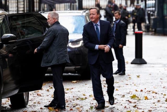 <p>David Cameron is seen entering Downing Street on Monday morning </p>