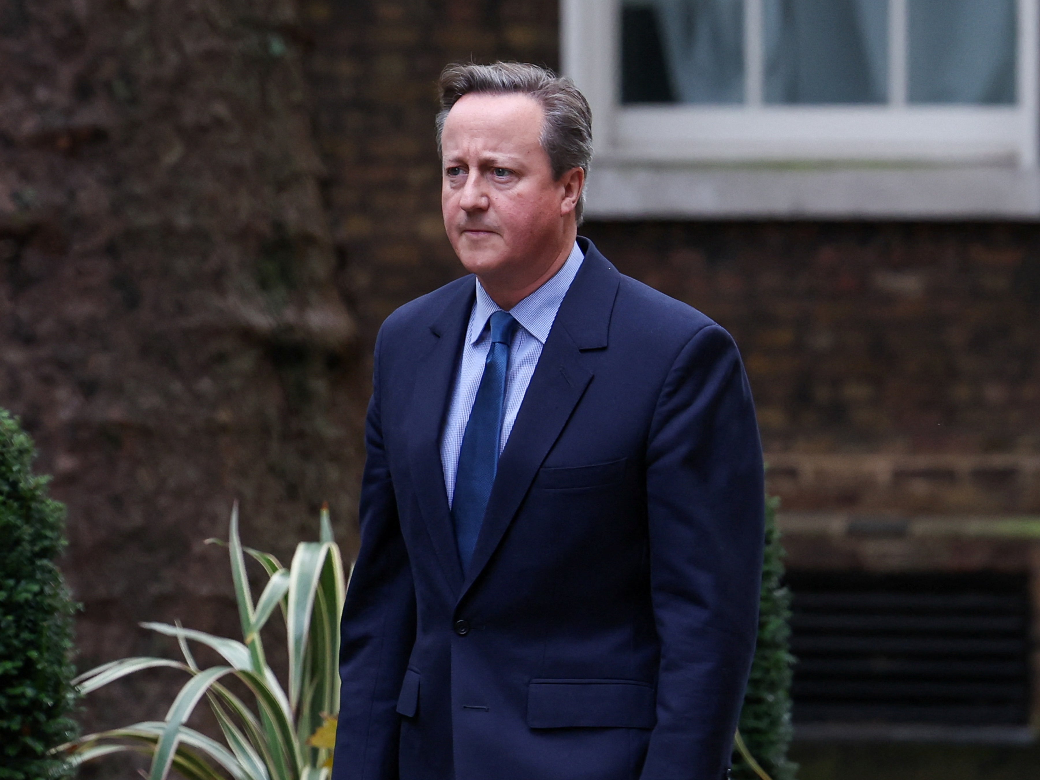 David Cameron re-enters Downing Street