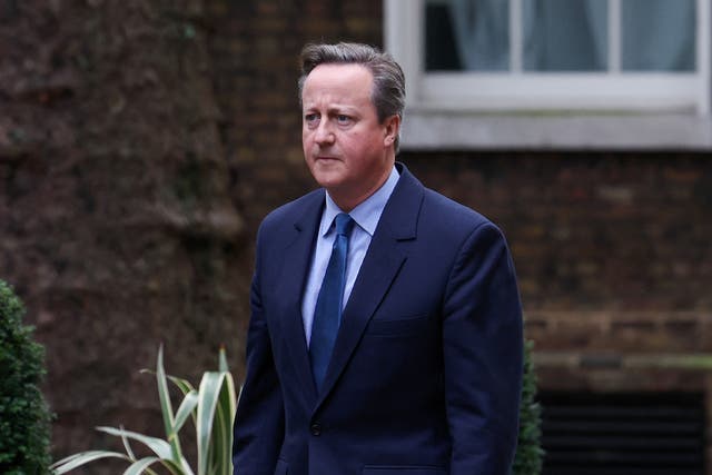 <p>David Cameron re-enters Downing Street </p>
