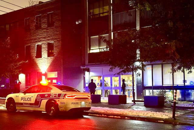 <p>File: Police cars sit in front of Talmud Torah Elementary School as parents pick up their children in the Cote-des-Neiges neighborhood of Montreal, Quebec, Canada, on 9 November 2023</p>