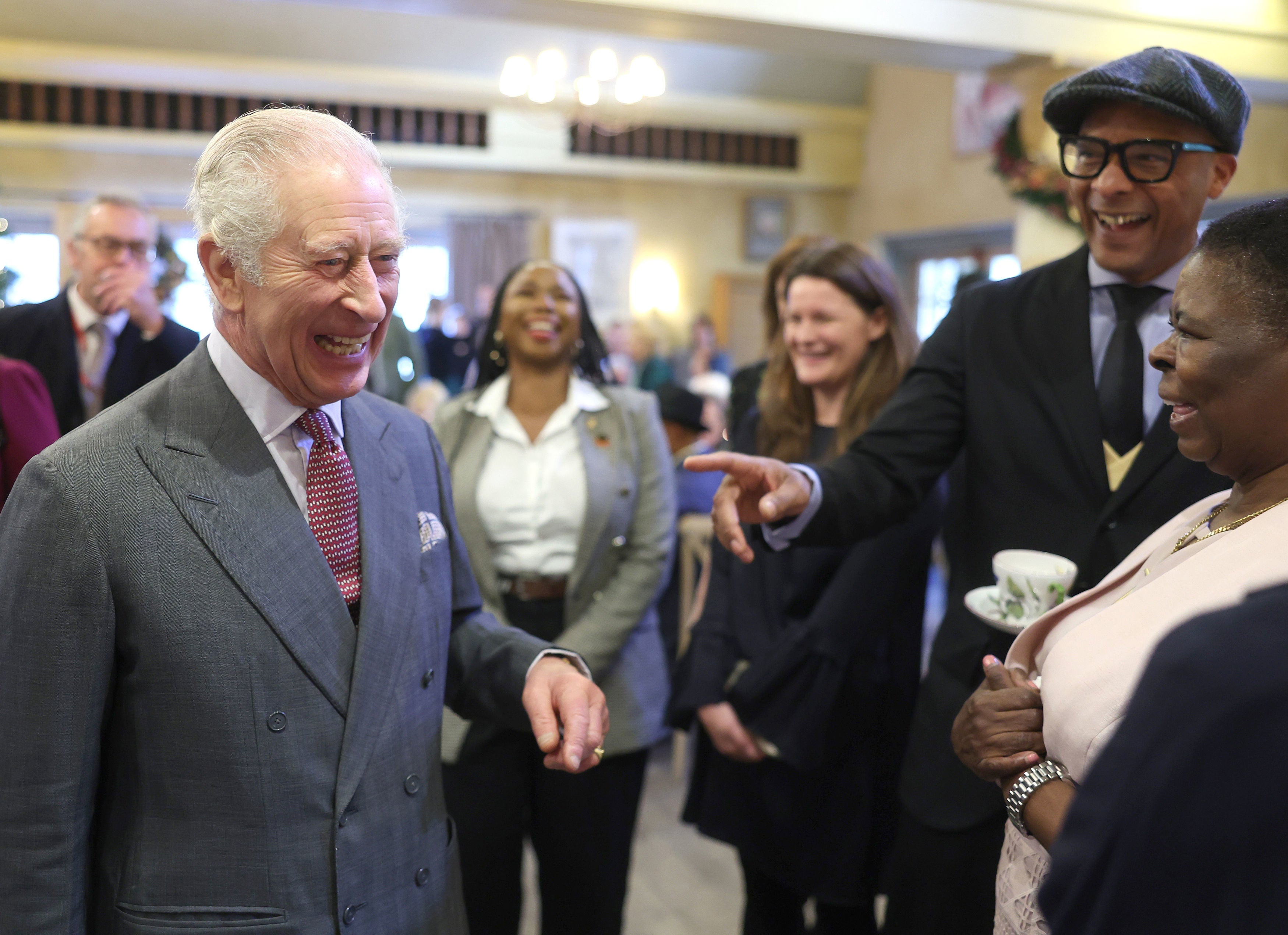 King Charles III talking to Jay Blades during his 75th birthday party at Highgrove Gardens