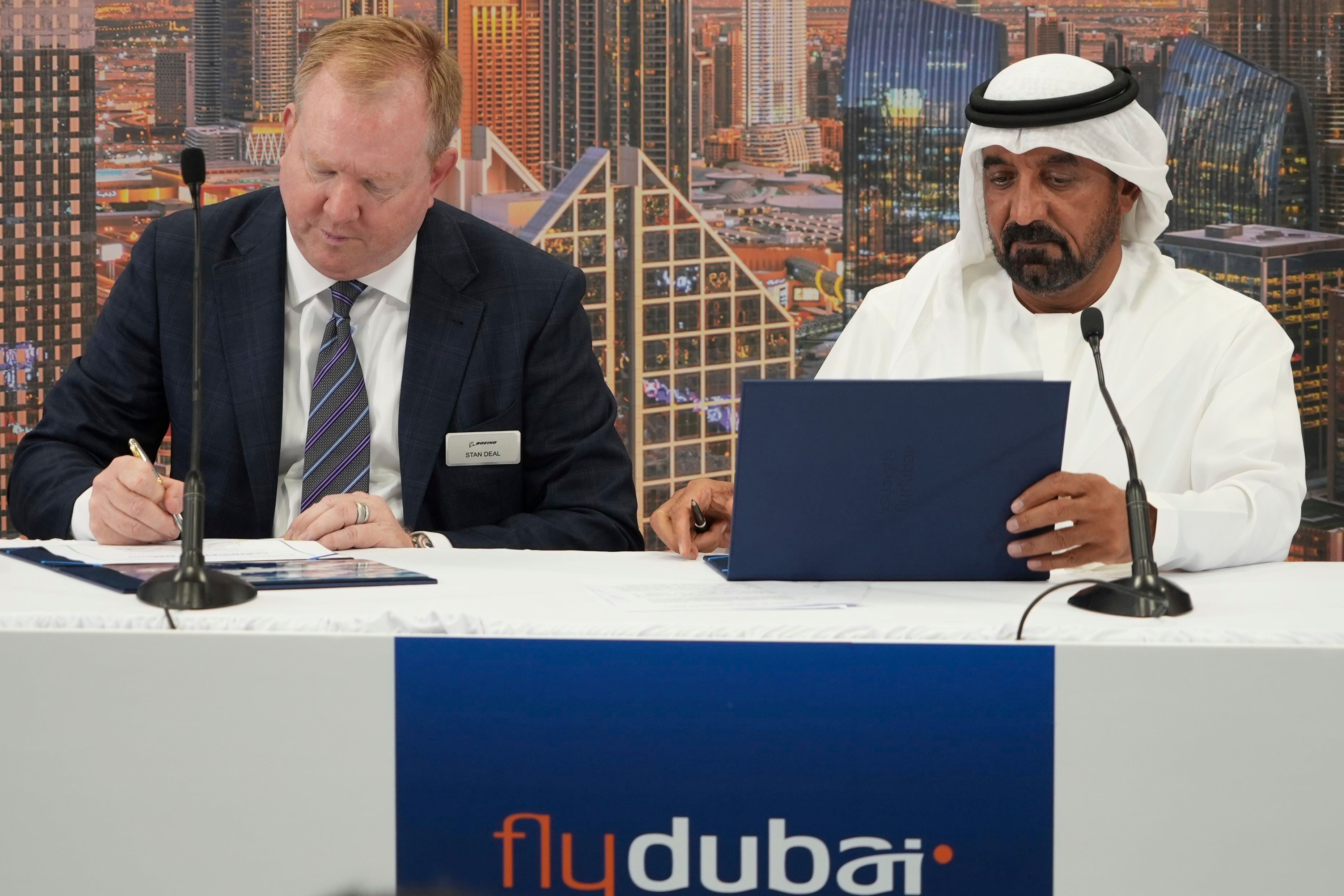 Boeing VP Stan Deal, left, and Emirates chief Sheikh Ahmed bin Saeed Al Maktoum, sign Monday’s deal