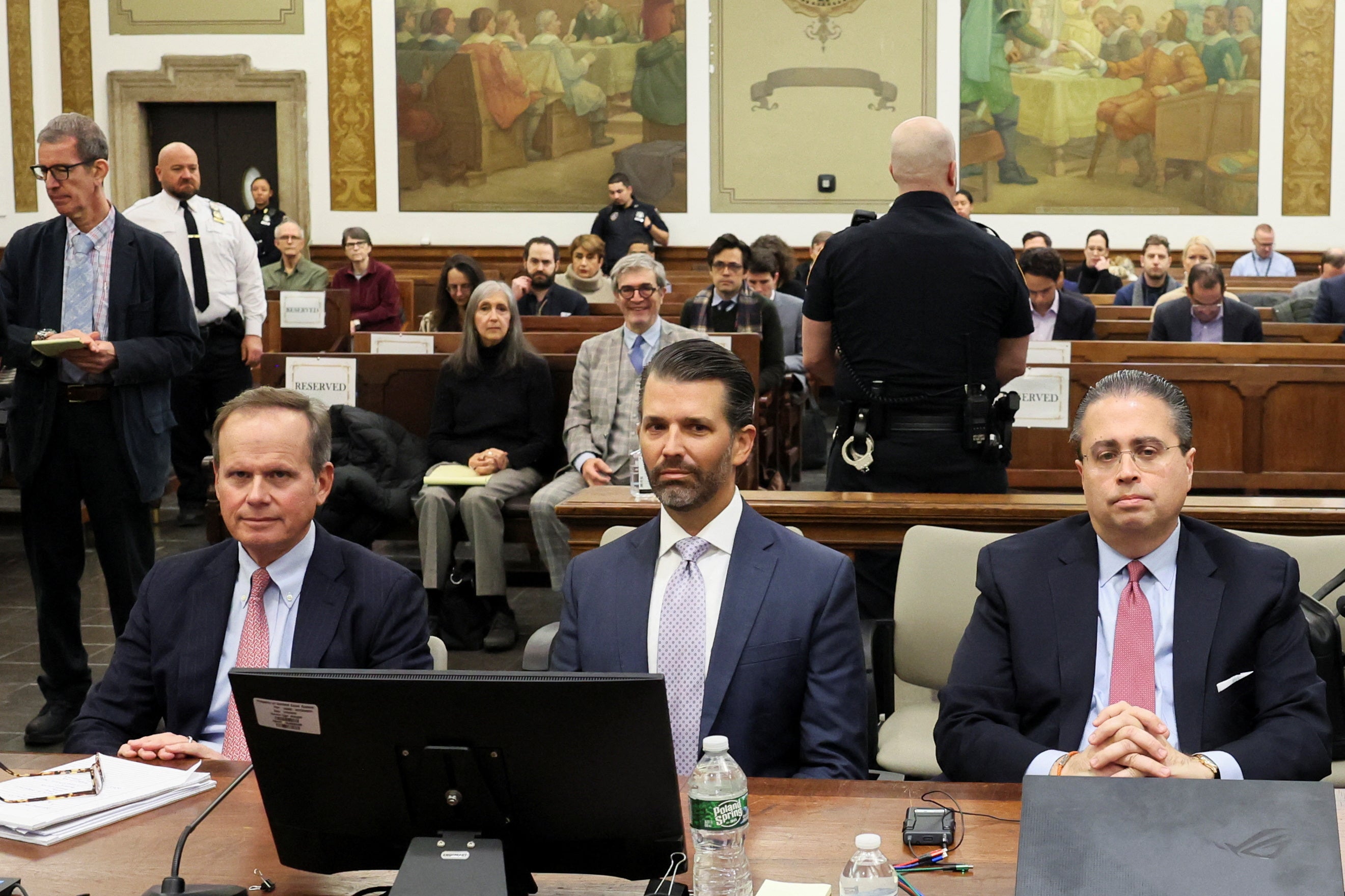 Donald Trump Jr sits with attorneys Christopher Kise, left, and Clifford Robert, right, on Monday