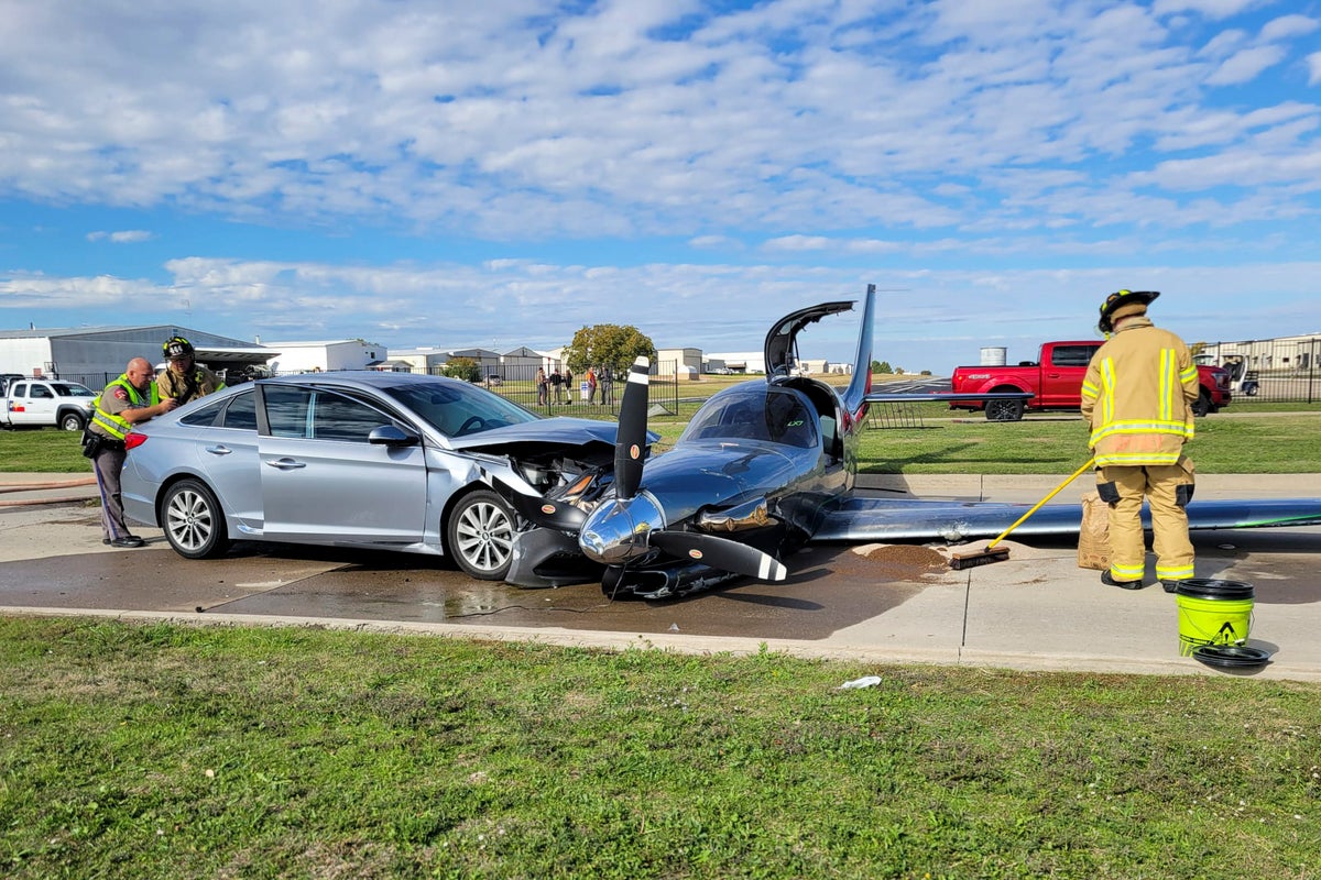 Small plane crashes into car after overshooting runway during