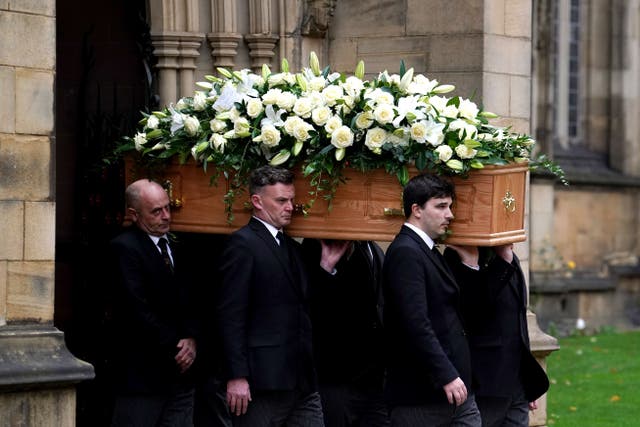 The coffin of Sir Bobby Charlton is carried out of Manchester Cathedral after the funeral service (Martin Rickett/PA)