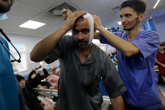 <p>An injured Palestinian man receives treatment at al-Shifa Hospital, following Israeli airstrikes on Gaza City </p>