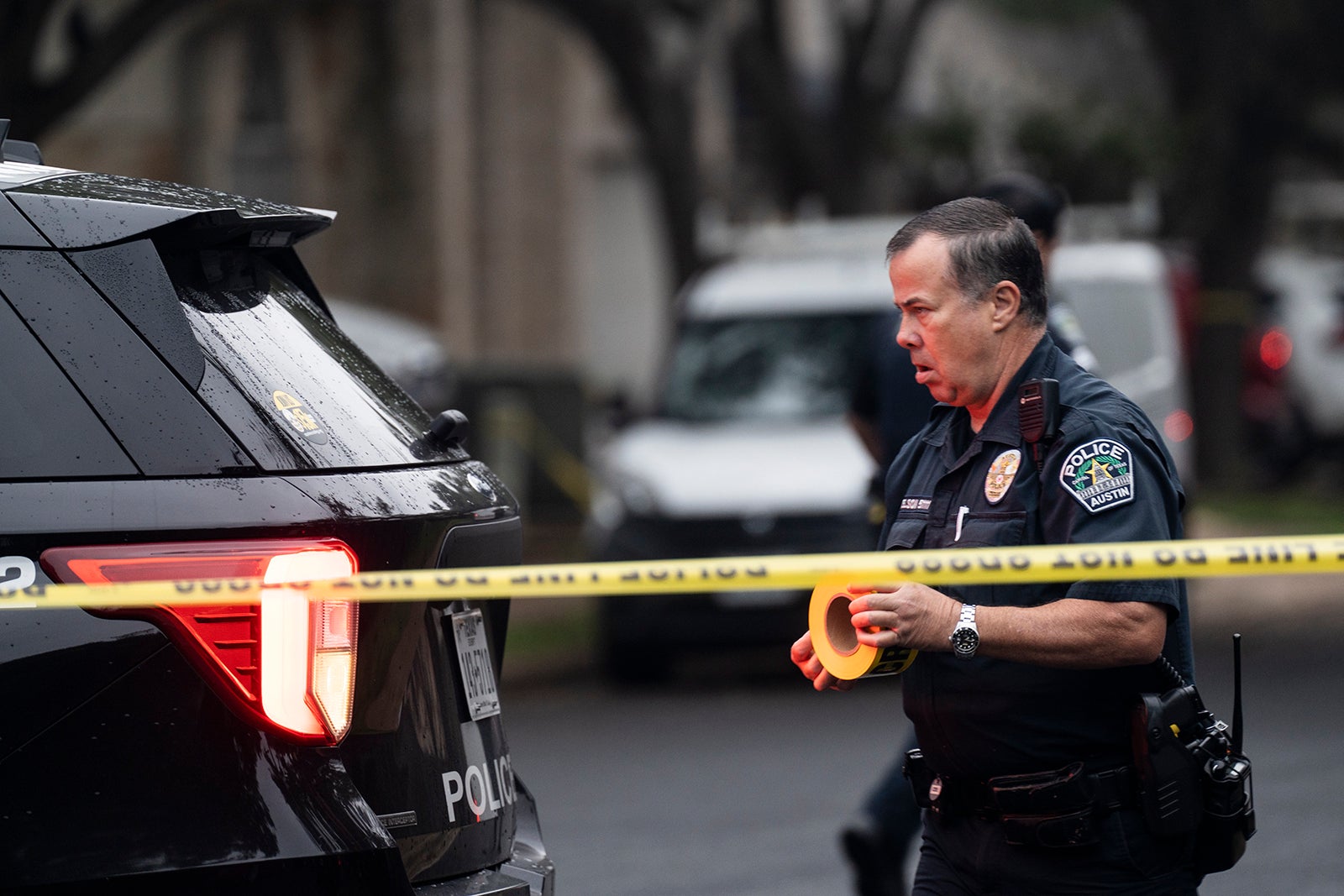 The Austin Police Department investigates the crime scene after an Austin police officer died following a shooting in South Austin, Texas on Saturday, Nov. 11, 2023.