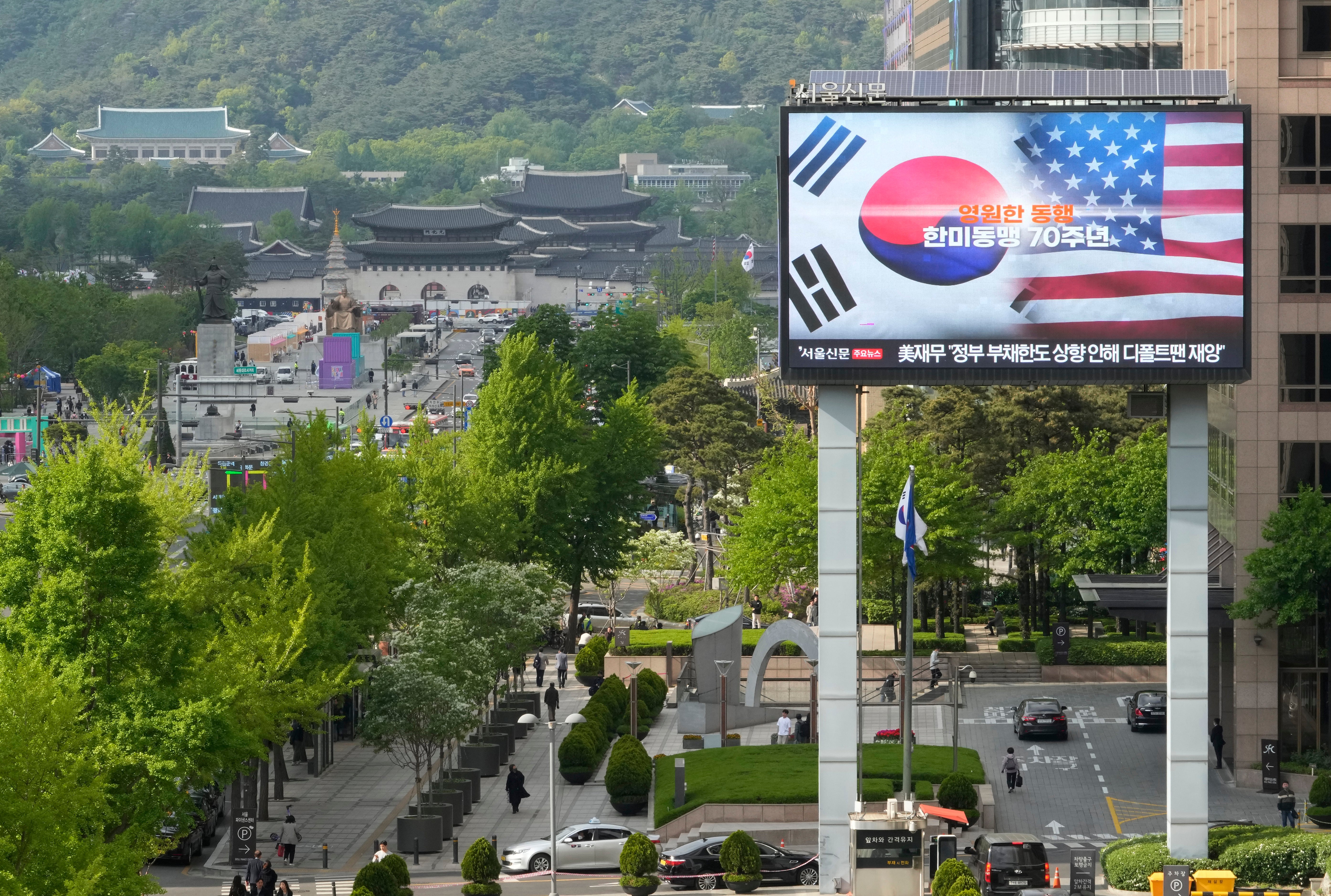 A screen shows flags of South Korea and the United States to celebrate the 70th anniversary of the South Korea-U.S. alliance in Seoul, South Korea, Wednesday, April 26, 2023