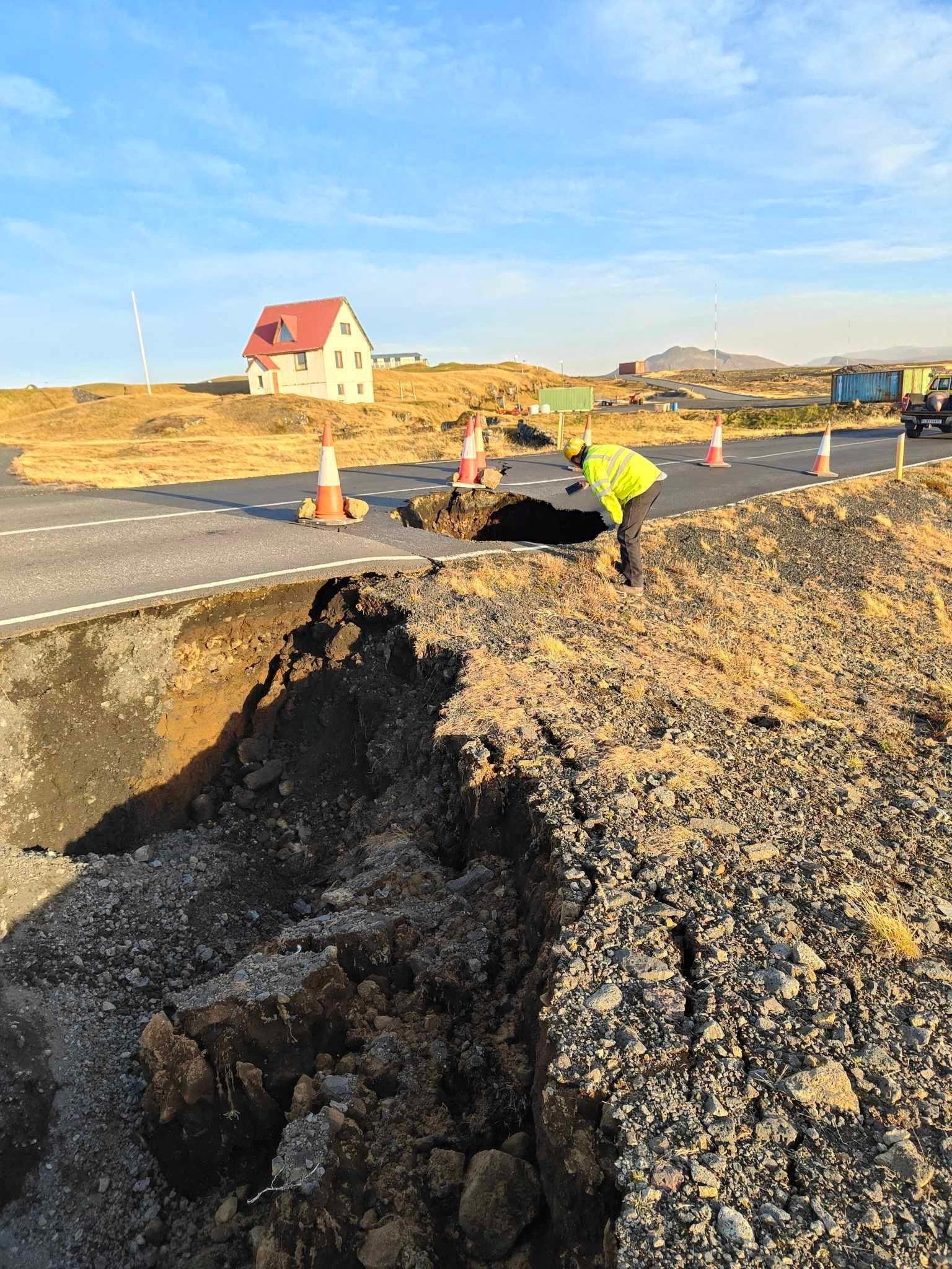 <p>A view of cracks, emerged on a road due to volcanic activity, near Grindavik</p>