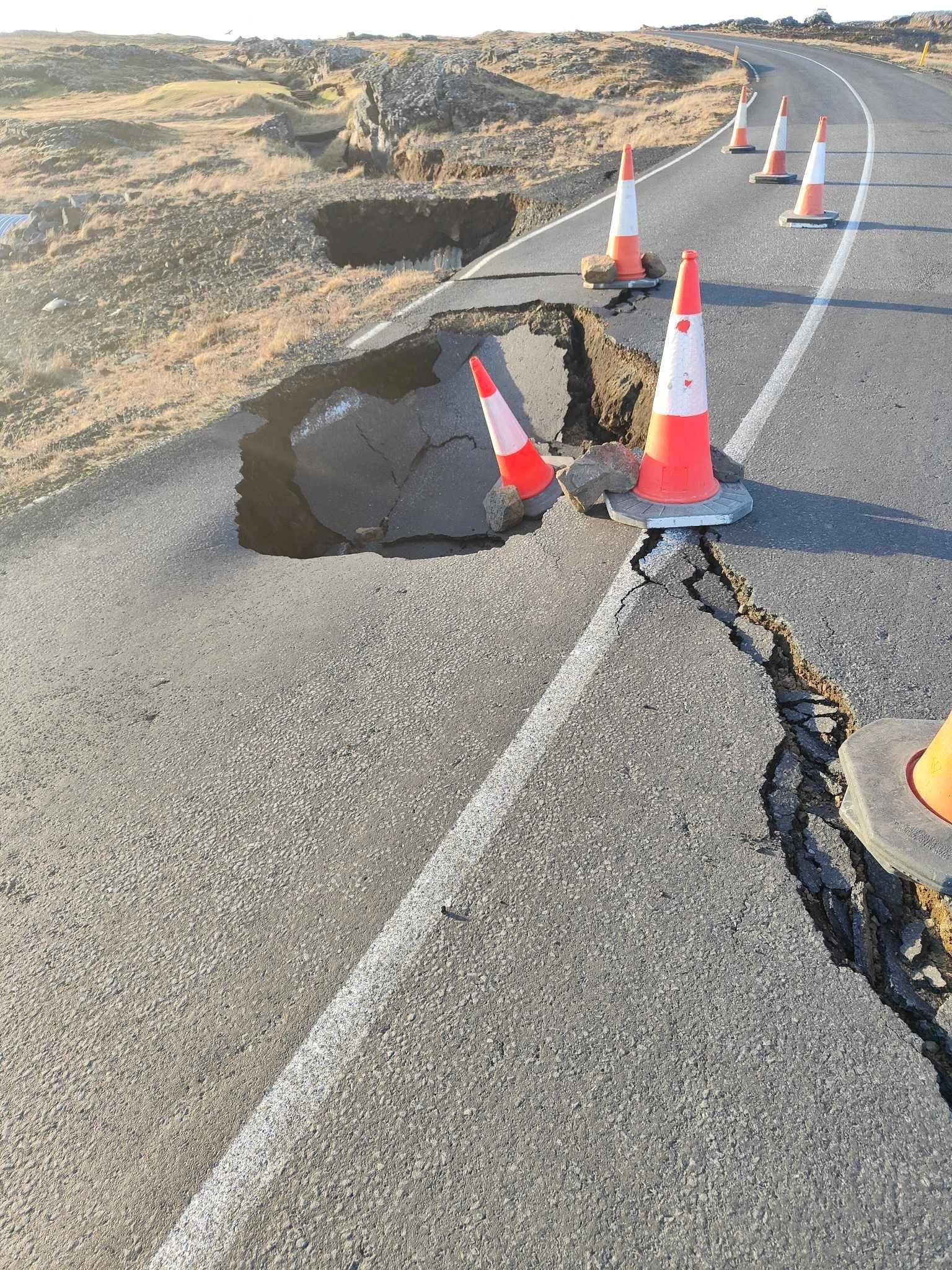 <p>A view of cracks, emerged on a road due to volcanic activity, near Grindavik</p>