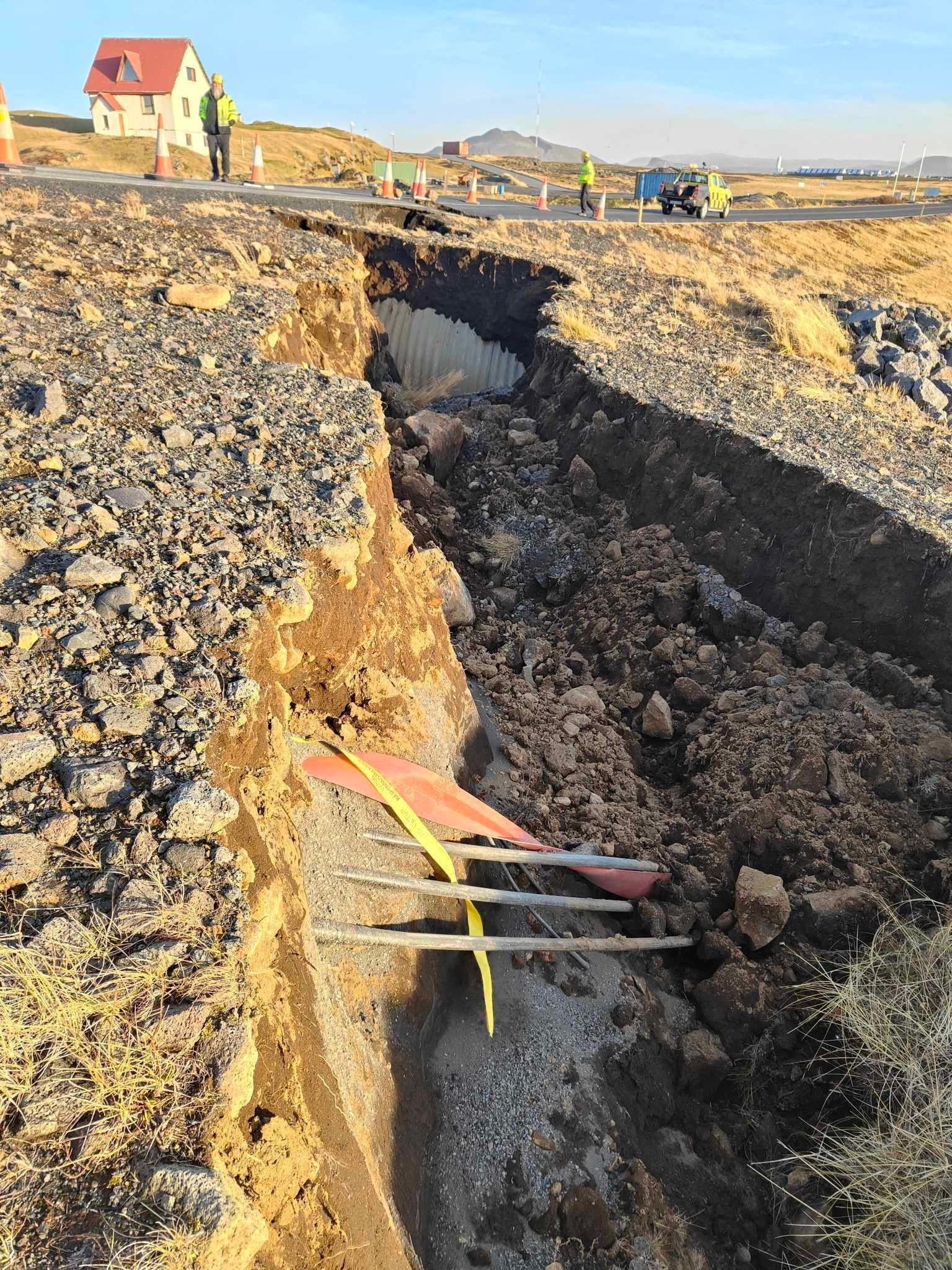 <p>A view of cracks, emerged on a road due to volcanic activity, near Grindavik, Iceland 13 November 2023</p>