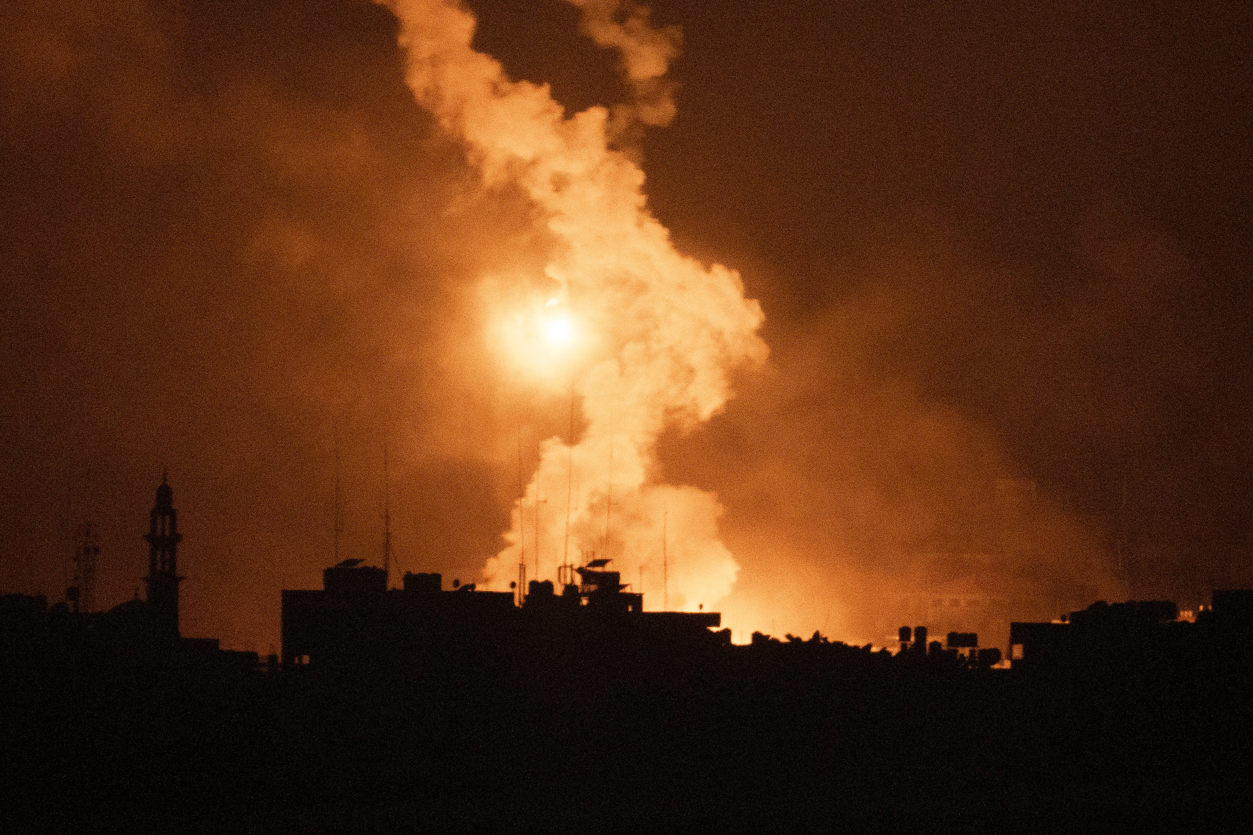Flares rise over the Gaza Strip, as seen from southern Israel