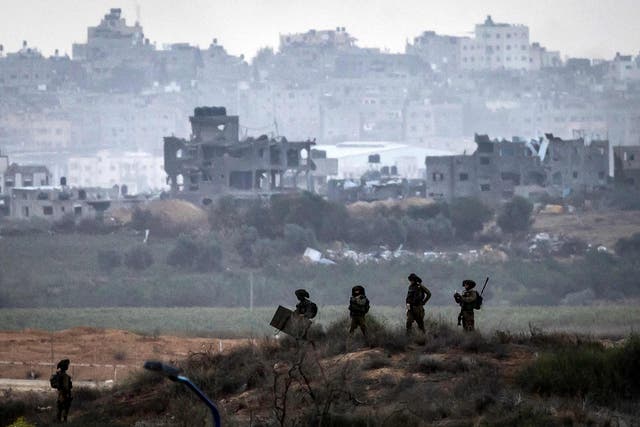 <p>This picture taken from a position along the border with the Gaza Strip in southern Israel shows Israeli soldiers amid ongoing battles with the Palestinian militant group Hamas, on November 14, 2023</p>