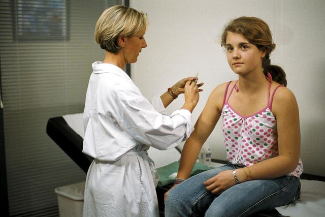 A girl receives one of the human papillomavirus vaccines (Merck and Sanofi Pasteur/PA)