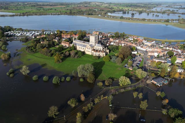 High water levels around Tewkesbury Abbey in October (Jacob King/PA)