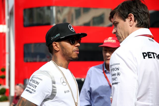 Mercedes team principal Toto Wolff (right) is driven to help Lewis Hamilton (left) win an eighth F1 drivers’ title (David Davies/PA).