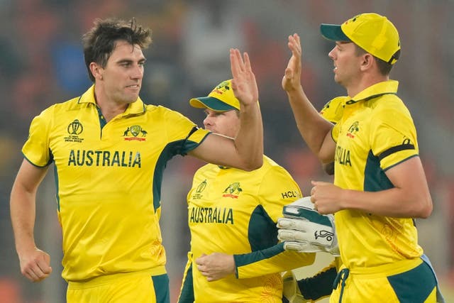 Pat Cummins, left, heads into Australia’s World Cup semi-final full of confidence (Mahesh Kumar A./AP)