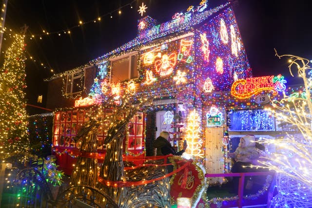A person take a photo of Andrew Walters’ Christmas light display at his home in Stillington, County Durham, which will raise funds through public donations for the Teenage Cancer Trust. Picture date: Tuesday November 14, 2023.