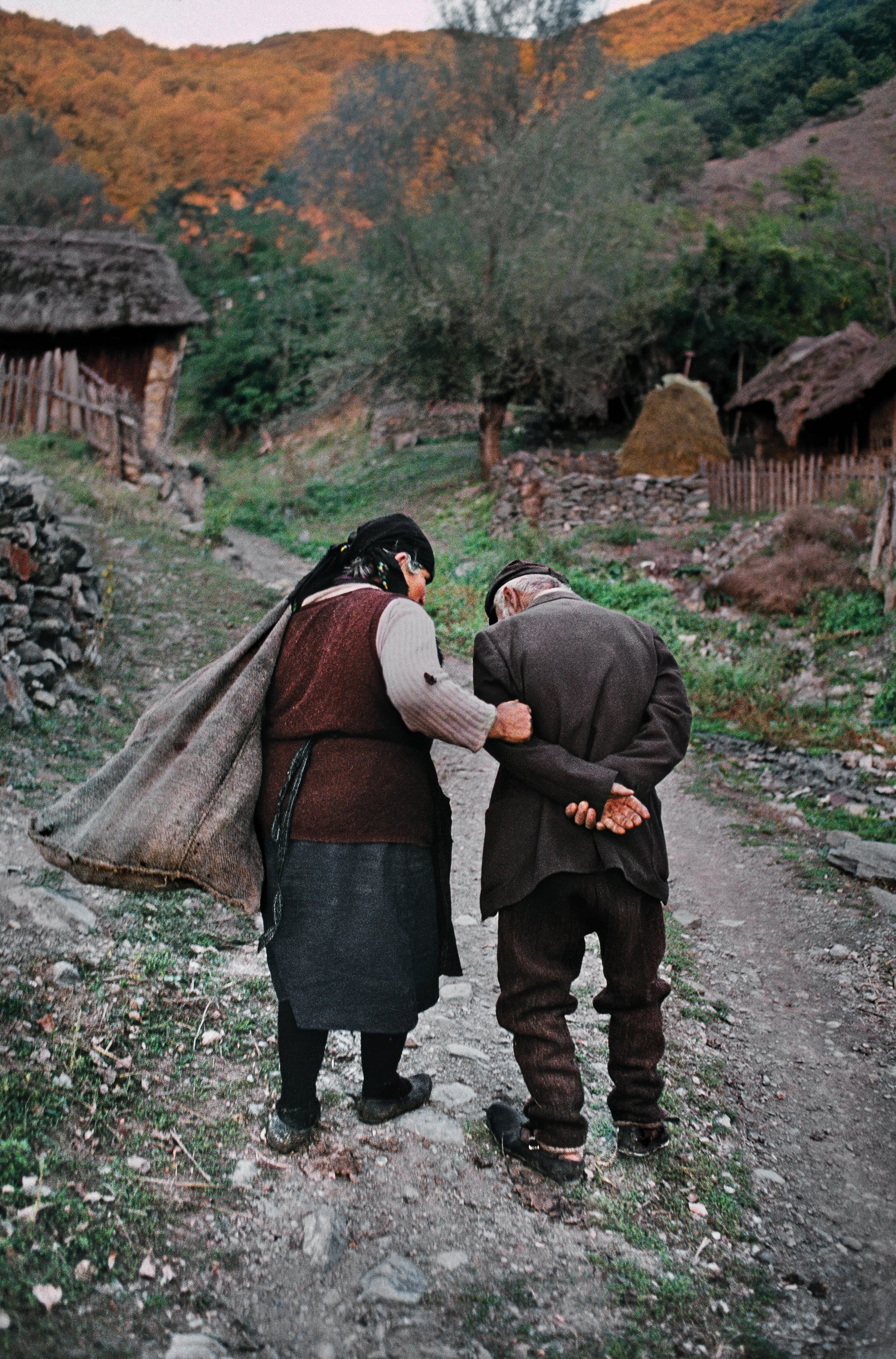 A husband and wife return home after working in their corn fields in Gostivar, in what is now called North Macedonia