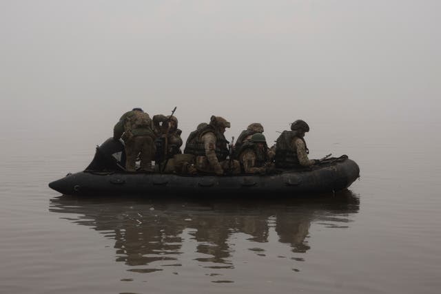 <p>Ukrainian marines sail along the Dnipro River at the frontline near Kherson last month </p>