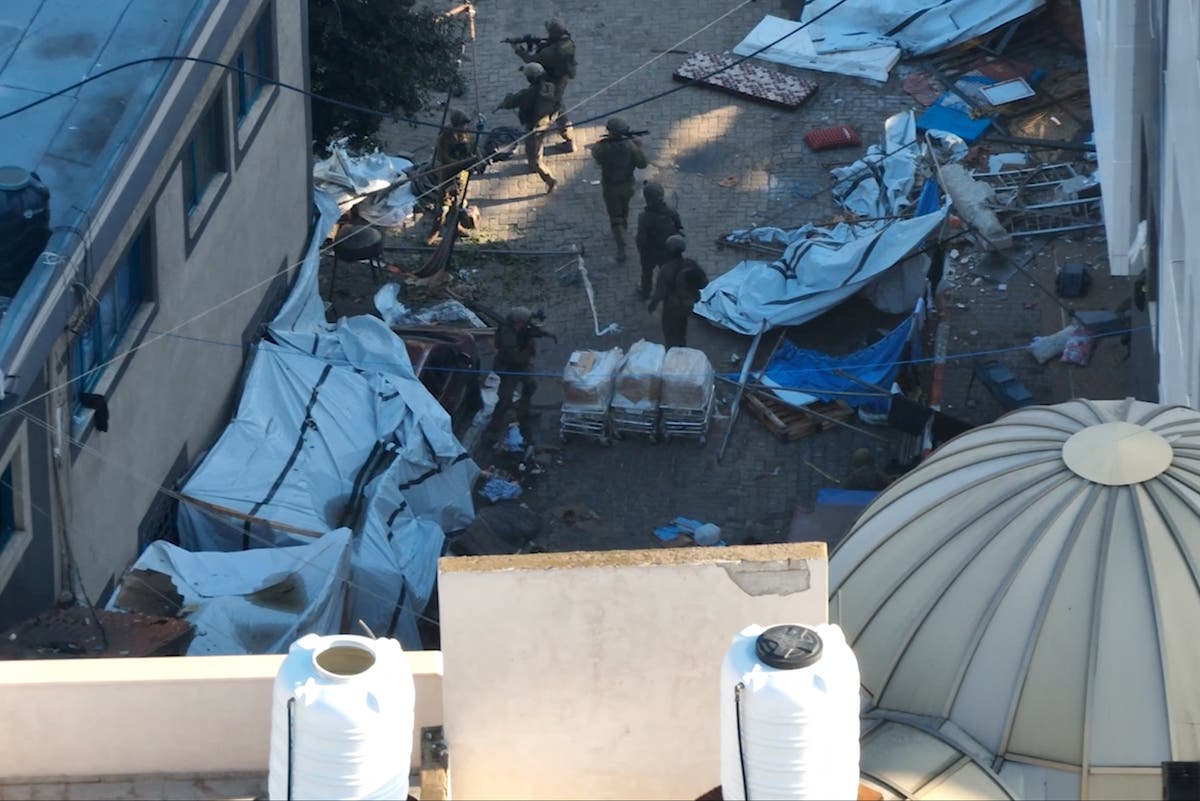 Gunfire from Israeli raid on Gaza&rsquo;s largest hospital leaves medics &lsquo;unable to move between buildings&rsquo;