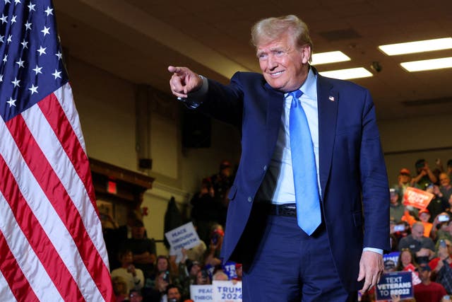 <p>Former president Donald Trump gestures during a campaign rally in Claremont, New Hampshire on 11 November 2023</p>