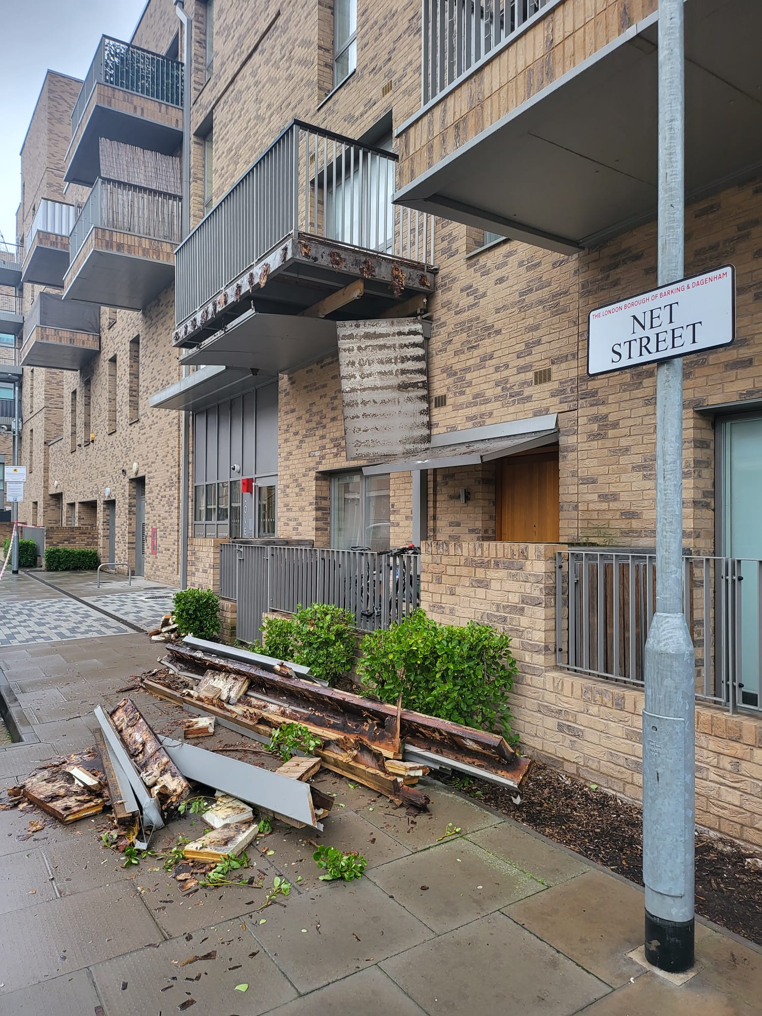 The balcony partially collapsed and scraps of metal could be seen hanging loosely