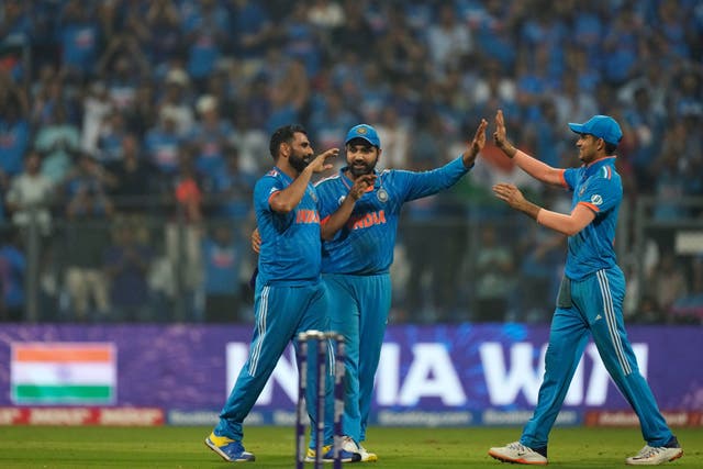 India’s captain Rohit Sharma (centre) felt his side dug in to see off New Zealand and book their place in the World Cup final (Rajanish Kakade/AP)