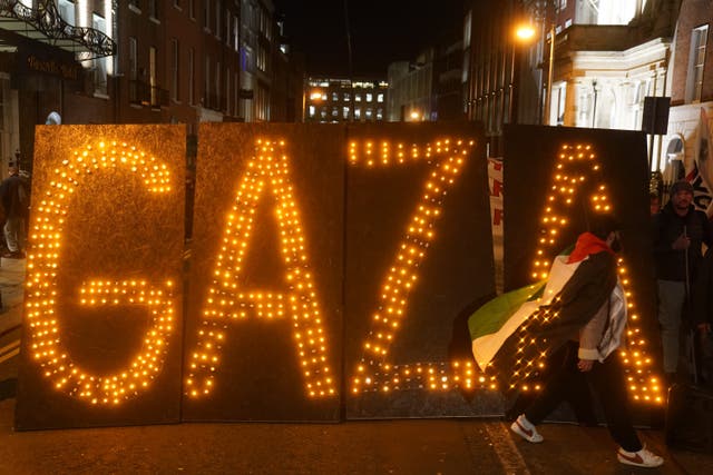People attending a pro-Palestinian protest at Leinster House, Dublin (Brian Lawless/PA)