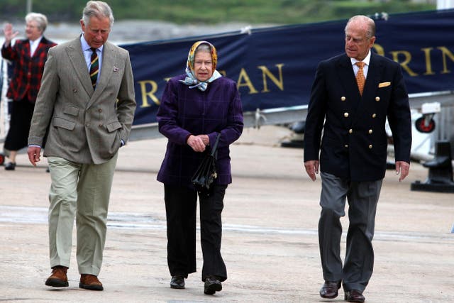 Queen Elizabeth II with the Duke of Edinburgh and the then Prince of Wales in 2010 (Andrew Milligan/PA)