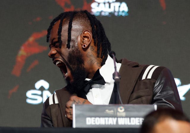 <p>Wilder looking in Joshua’s direction at Wednesday’s press conference</p>