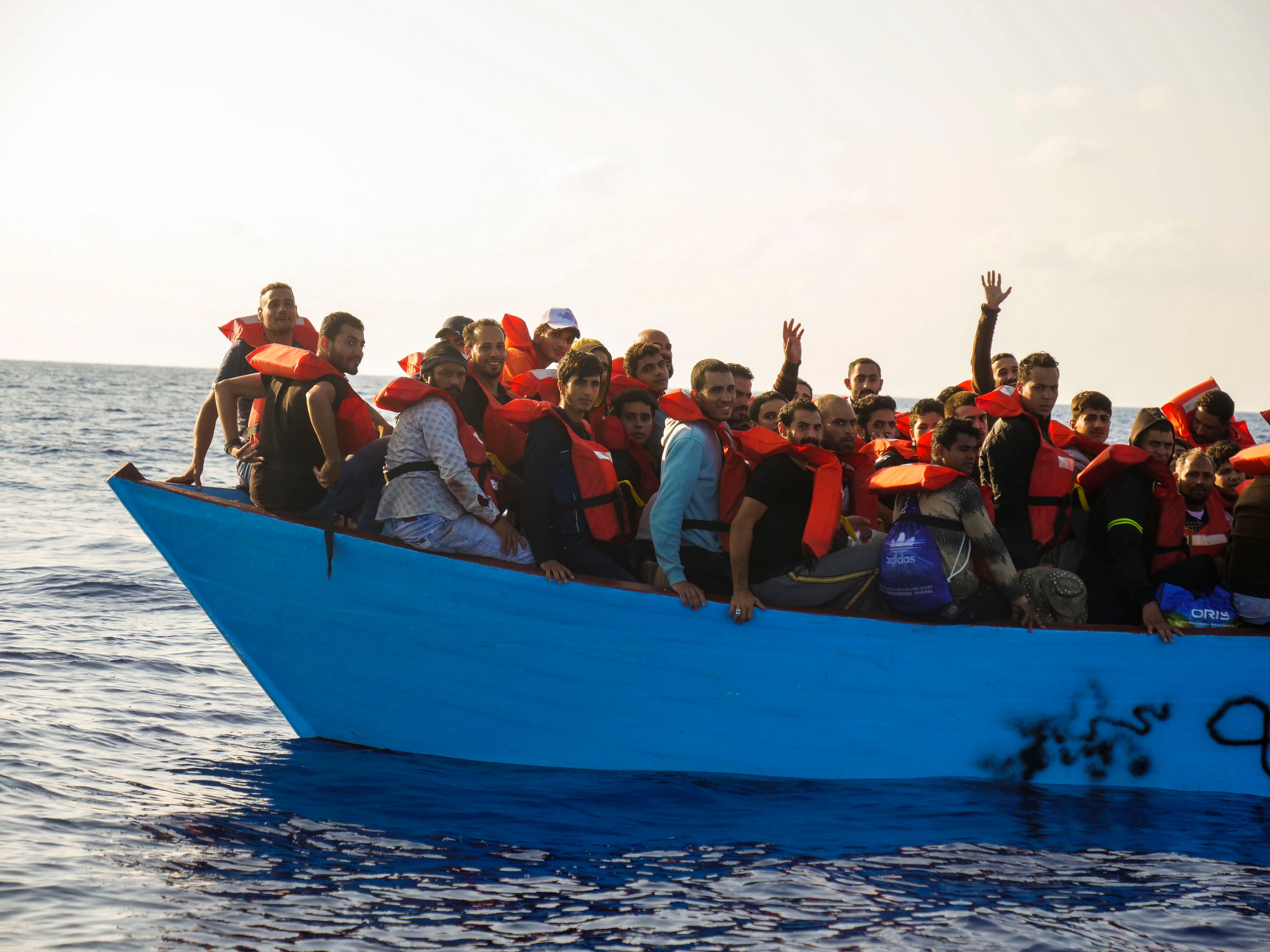 Migrants are rescued from the sea some 30 miles off the coast of Libya and heading for Europe