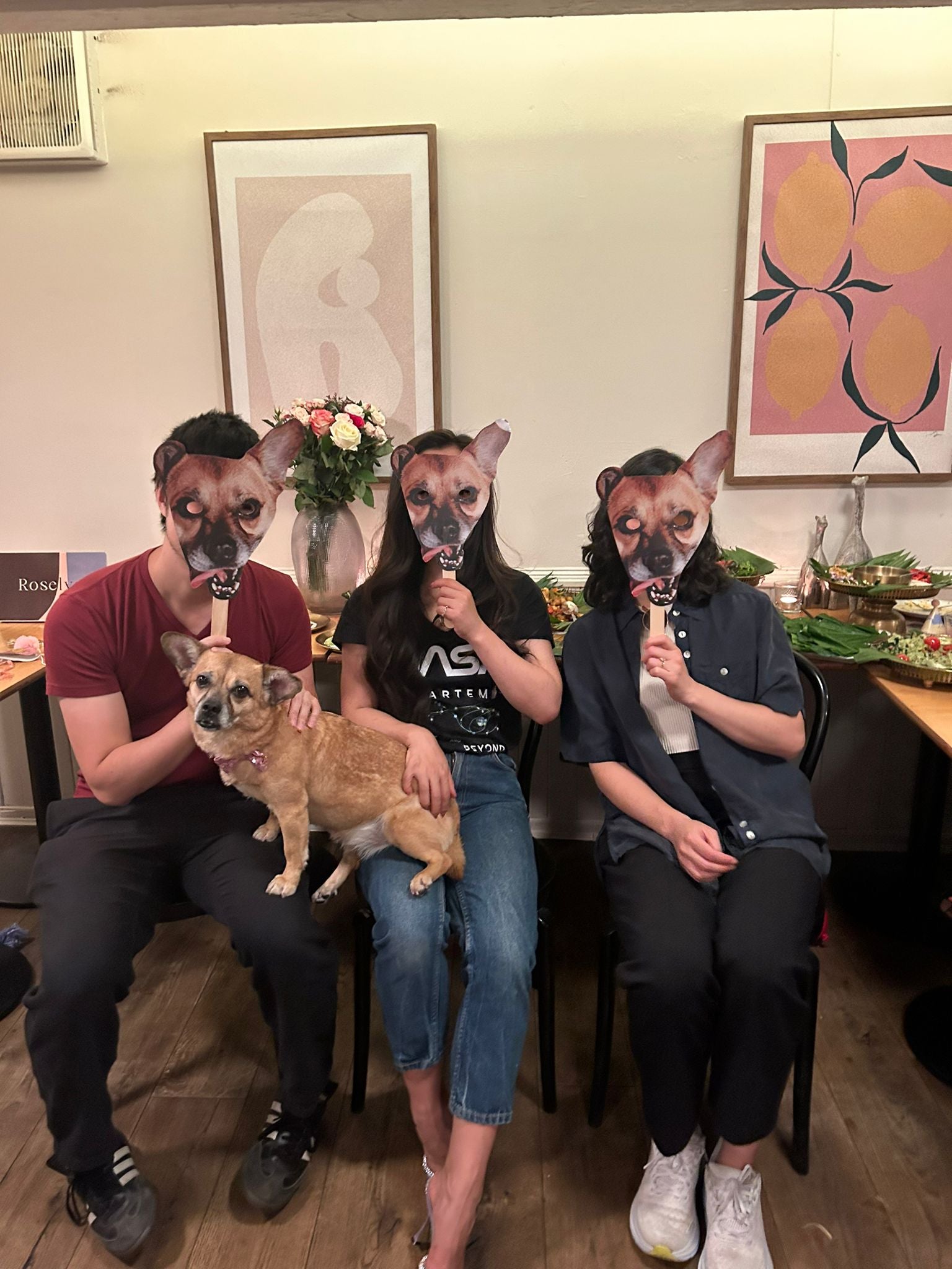 Ms Duan and her friends wearing Artemis photo masks at the pup’s recent birthday party