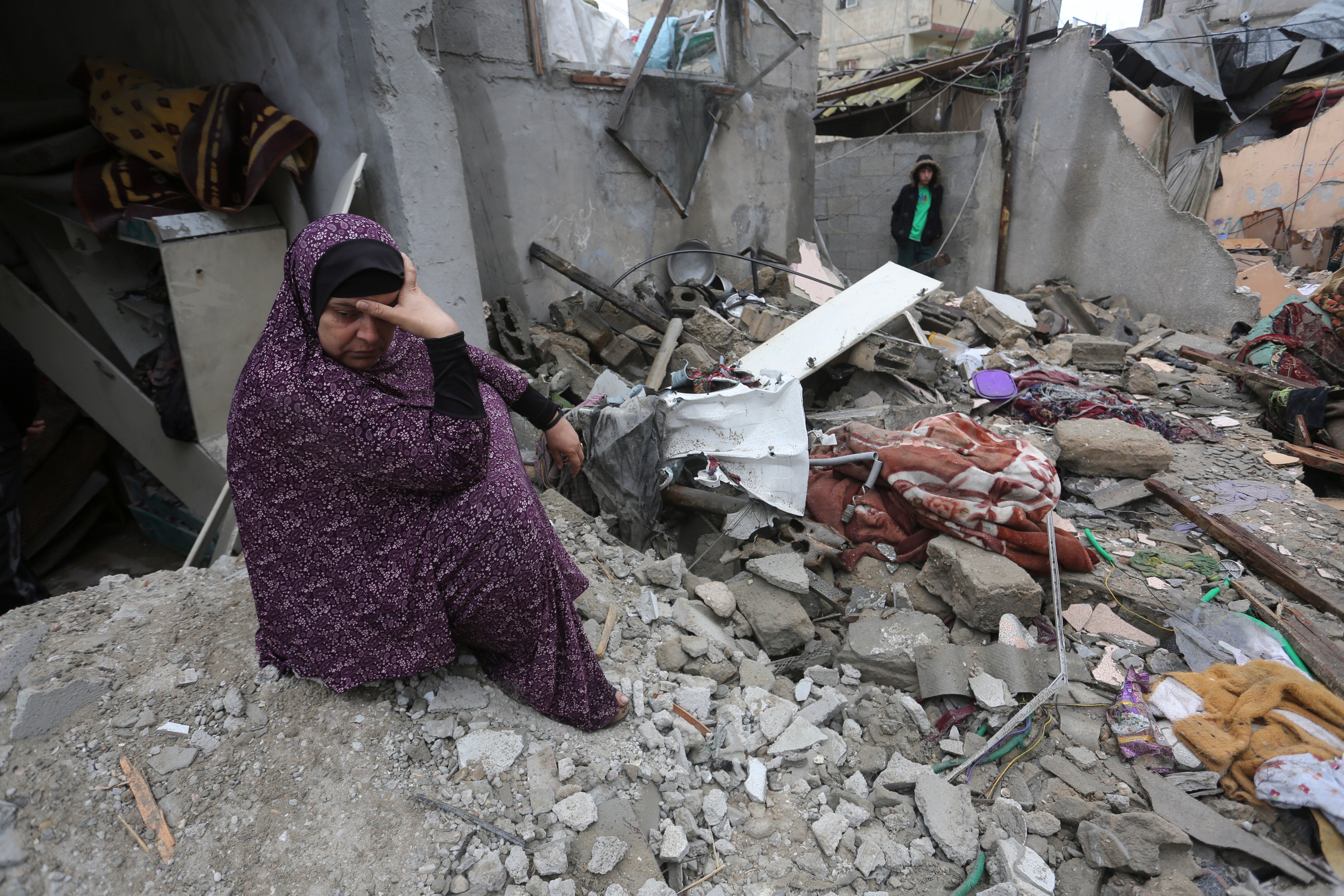 Palestinians look at destruction after Israeli strikes on Rafah, Gaza Strip on Wednesday