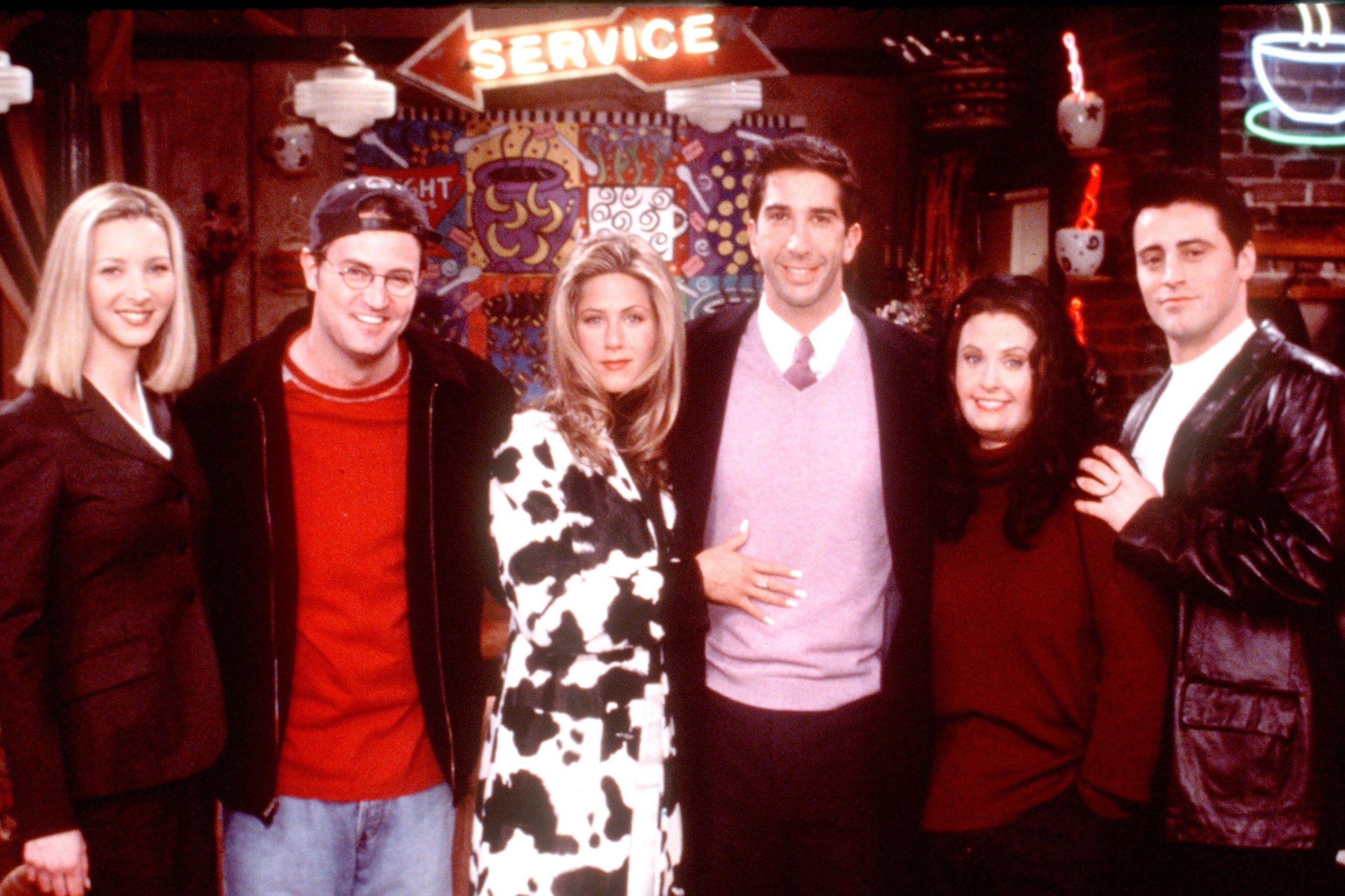 Perry alongside his co-stars in a promotional image for the hit sitcom