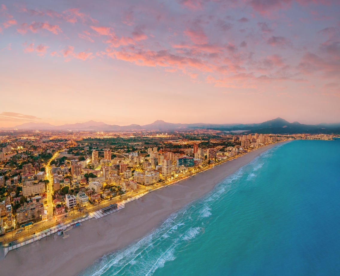 Campello beach at sunset in Alicante. A drone aerial view in Mediterranean sea of Spain at Costa Blanca