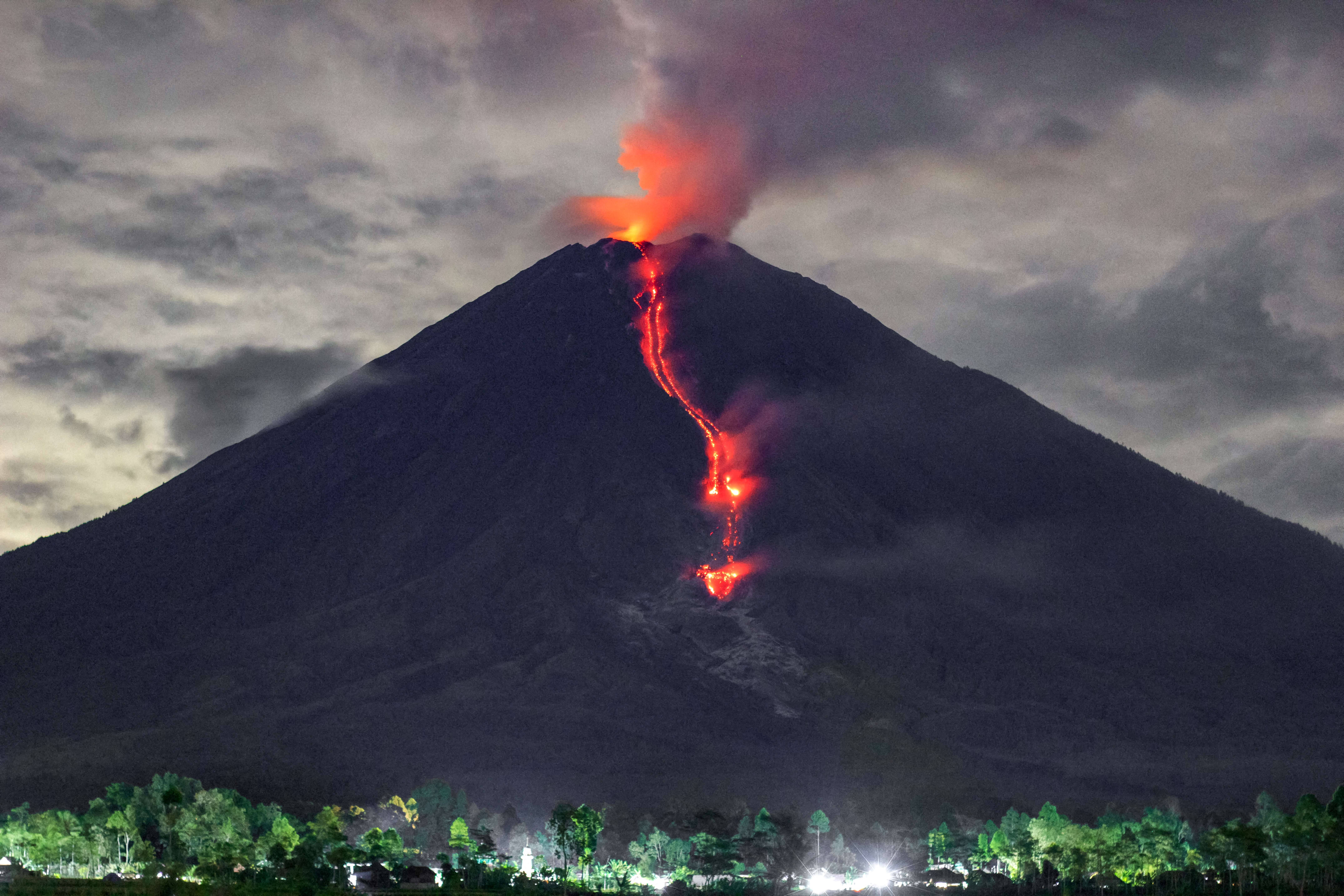 Lava hisses down Java’s Mount Semeru, which erupted on 4 December 2021