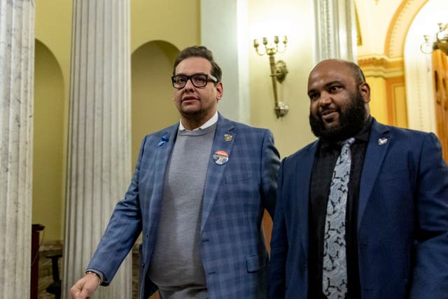 <p>George Santos and aide Vish Burra walk in the US Capitol </p>