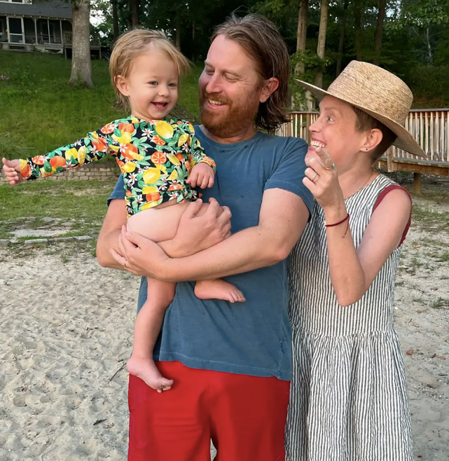 Ms McIntyre with her husband Andrew Gregory, and their 18-month-old daughter, Grace