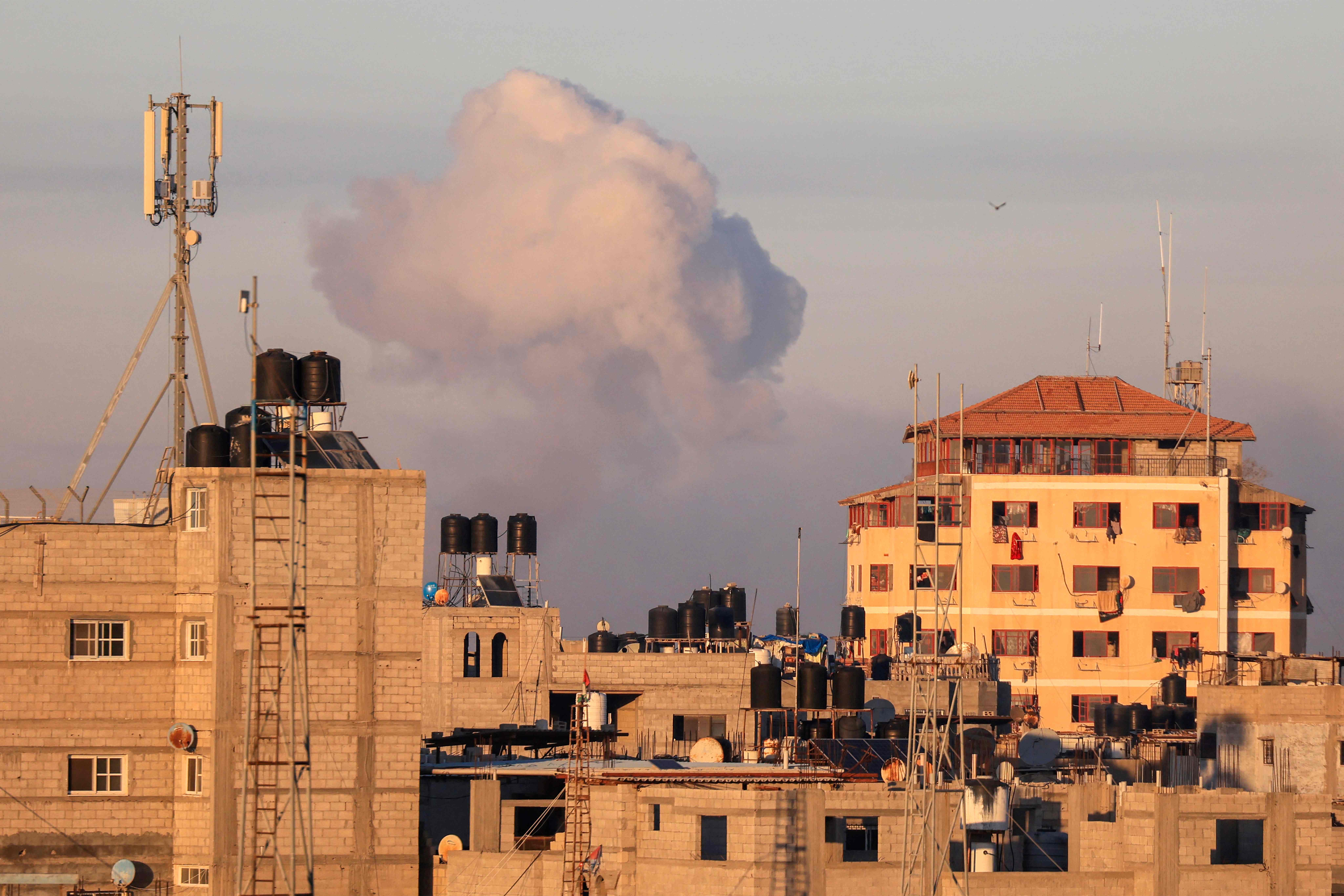 Smoke billows following an Israeli strike on Khan Yunis in the southern Gaza strip on Thursday