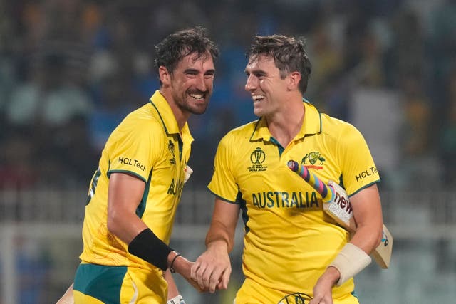 Australia’s captain Pat Cummins and Mitchell Starc (right) celebrate reaching the World Cup final (Bikas Das/AP)