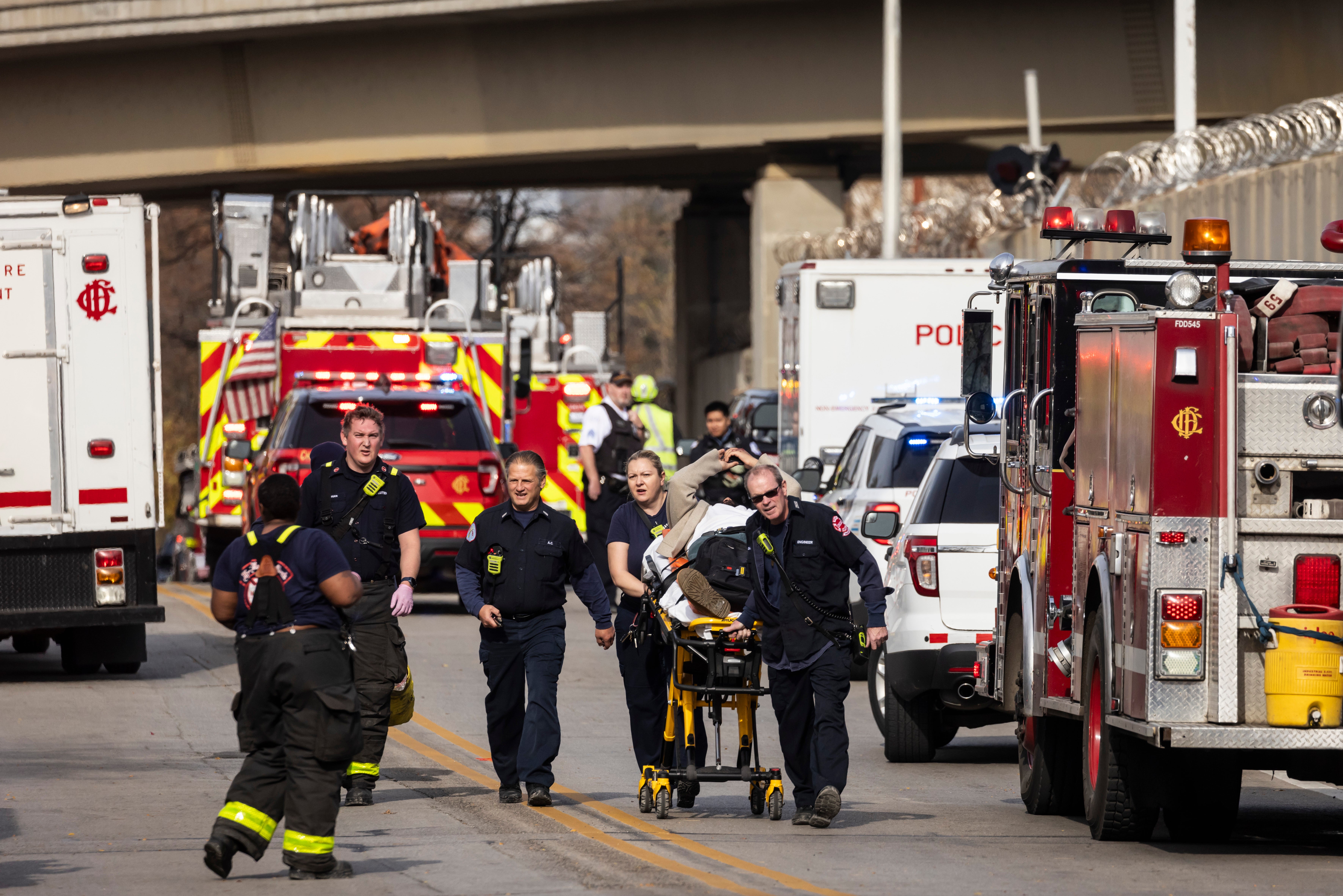 A person is taken away via ambulance after a Chicago Transit Authority train crashed into a piece of snow-removal equipment.