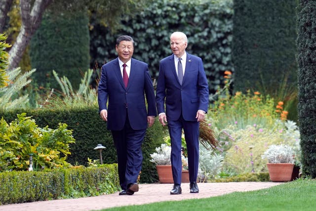 <p>President Joe Biden and China's President President Xi Jinping walk in the gardens at the Filoli Estate in Woodside, Calif., Wednesday, Nov, 15, 2023, on the sidelines of the Asia-Pacific Economic Cooperative conference. (Doug Mills/The New York Times via AP, Pool)</p>