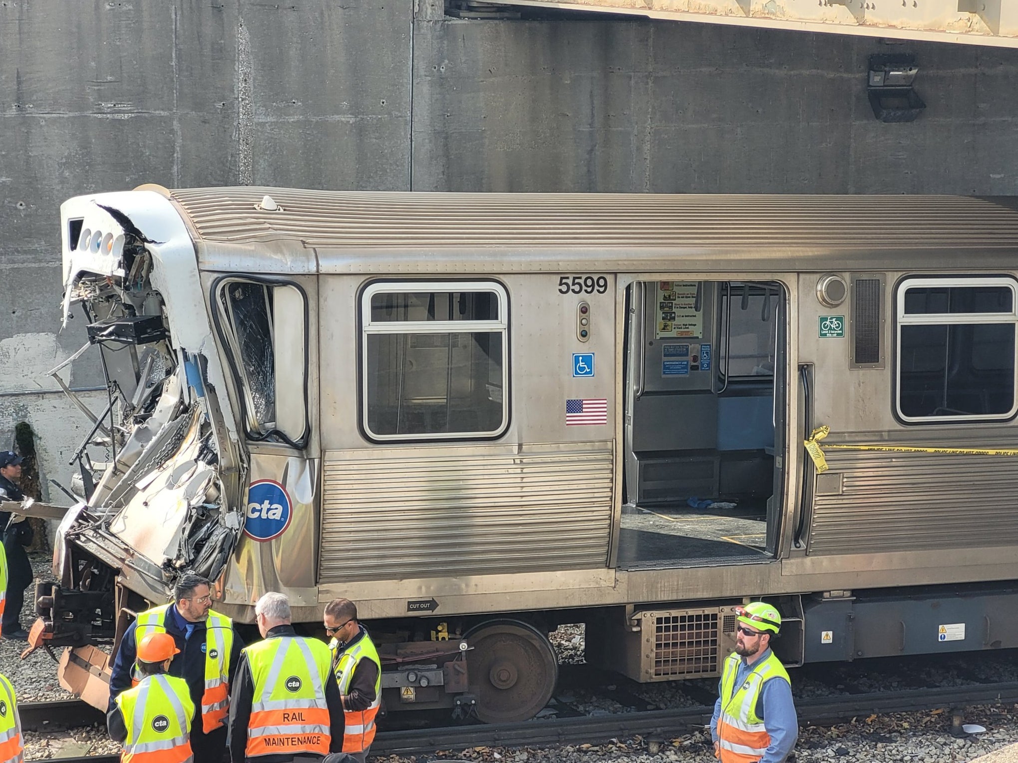 This handout photo provided by the Chicago Fire Department on November 16, 2023, shows workers examining the damage to a CTA train in Chicago, Illinois